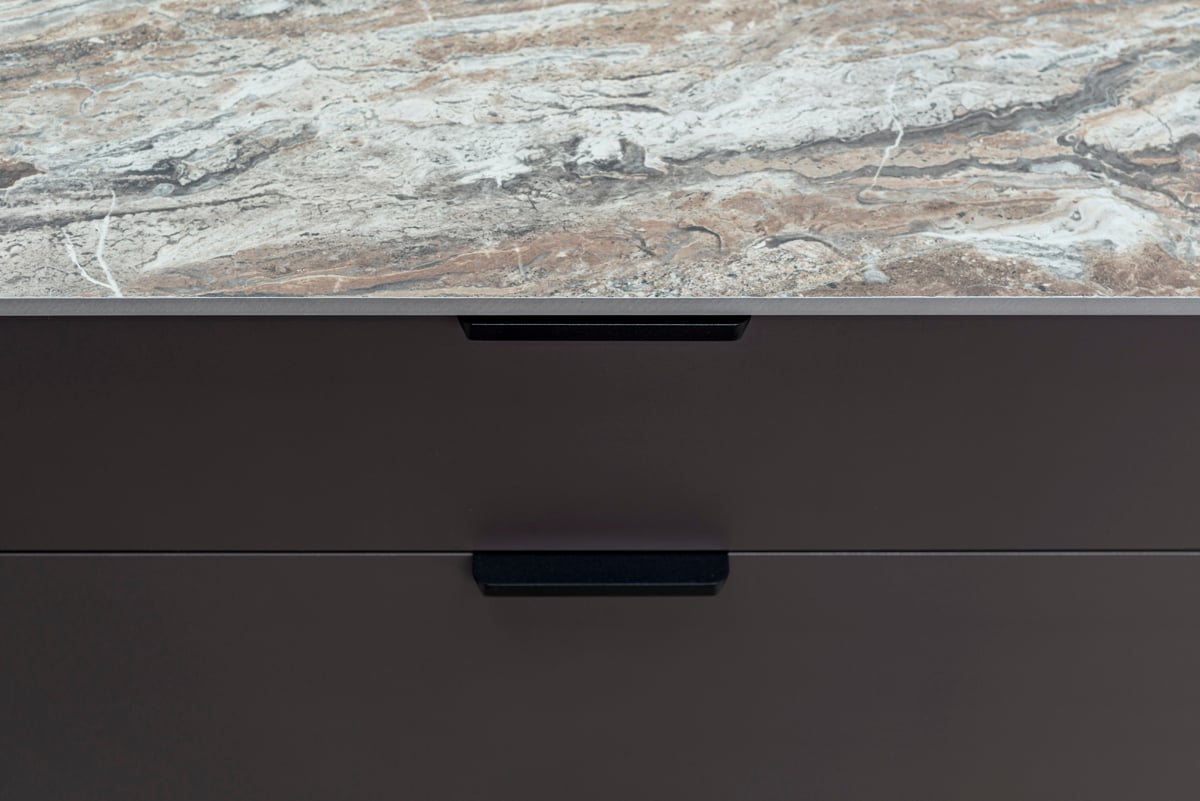Marble worktop with precision-cut matte black drawer hardware